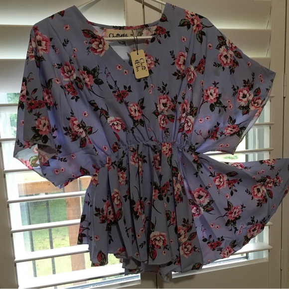 Cherie Bliss Flowing Asymmetrical Periwinkle Blouse.
Onesize fits most.US14 - Picture 2 of 5